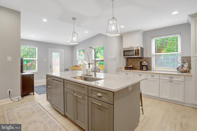 2914 6th St S, Arlington, VA 22204 - kitchen with a sink, appliances with stainless steel finishes, white cabinets, light wood-type flooring, and recessed lighting