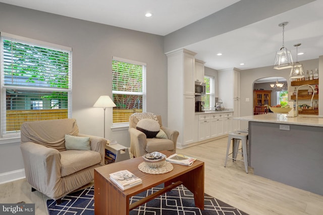 2914 6th St S, Arlington, VA 22204 - living room featuring light wood finished floors, healthy amount of natural light, arched walkways, recessed lighting, and baseboards