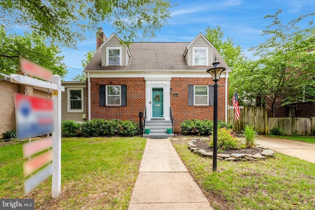 2914 6th St S, Arlington, VA 22204 - cape cod house with brick siding, a chimney, and a shingled roof