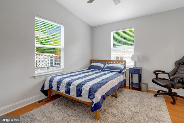 2914 6th St S, Arlington, VA 22204 - bedroom featuring wood finished floors, vaulted ceiling, baseboards, and a ceiling fan