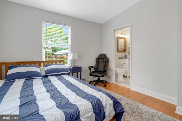 2914 6th St S, Arlington, VA 22204 - bedroom with wood finished floors, ensuite bathroom, and baseboards