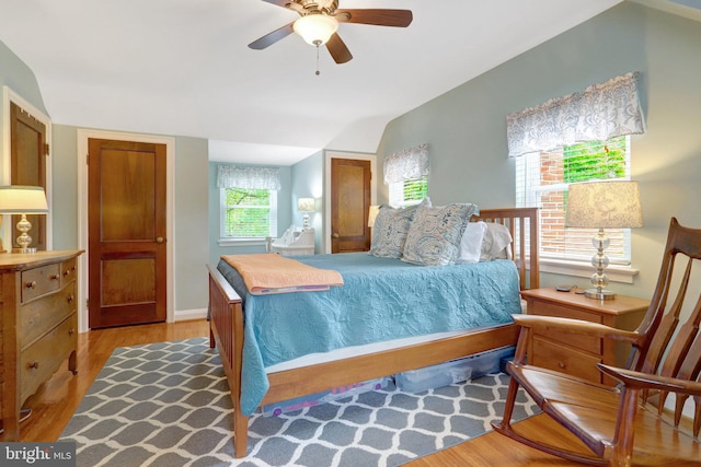 2914 6th St S, Arlington, VA 22204 - bedroom with light wood-style flooring, lofted ceiling, a ceiling fan, and baseboards