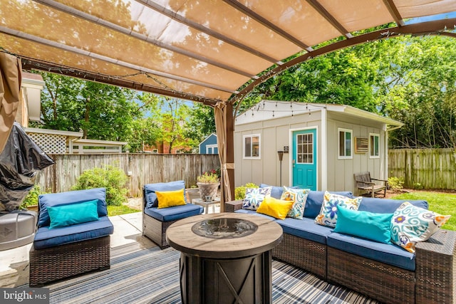 2914 6th St S, Arlington, VA 22204 - wooden deck featuring a fenced backyard, an outdoor living space with a fire pit, an outdoor structure, and a pergola