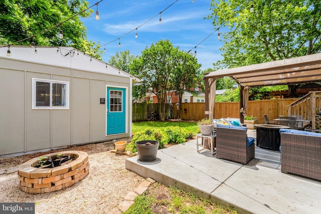 2914 6th St S, Arlington, VA 22204 - view of patio featuring a fenced backyard, an outdoor living space with a fire pit, and an outbuilding