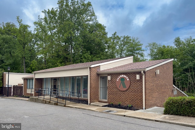 2 High Stepper Ct Unit 201, Baltimore, MD 21208 - view of front of house featuring brick siding and a shingled roof