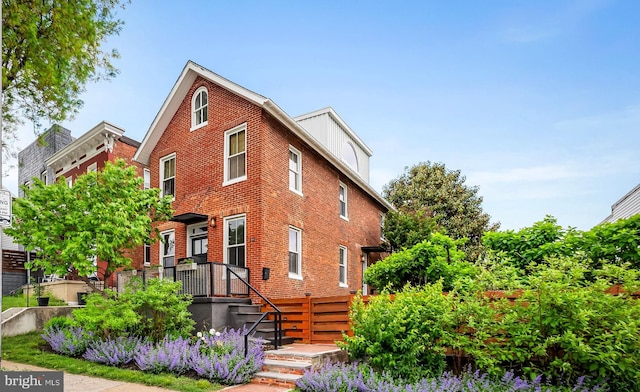 view of front of house with brick siding