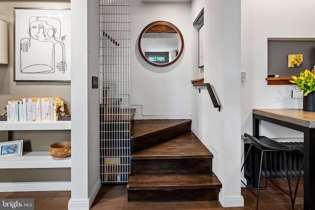 staircase featuring baseboards