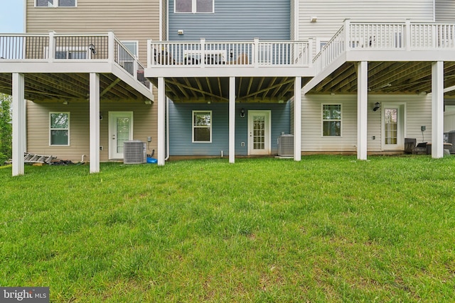 7853 Bluelick Run Rd, Baltimore, MD 21244 - rear view of property with a lawn, central air condition unit, and a deck