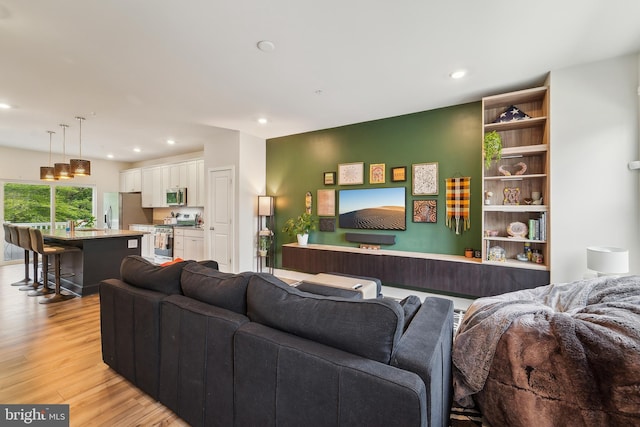 7853 Bluelick Run Rd, Baltimore, MD 21244 - living room featuring light wood-style flooring and recessed lighting