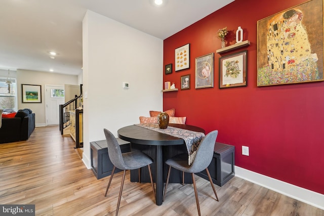 7853 Bluelick Run Rd, Baltimore, MD 21244 - dining space featuring stairs, recessed lighting, wood finished floors, and baseboards