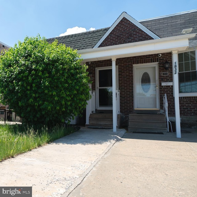 1834 Mower St, Philadelphia, PA 19152 - entrance to property featuring brick siding and roof with shingles