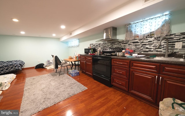 1834 Mower St, Philadelphia, PA 19152 - kitchen with wall chimney range hood, a sink, black electric range oven, recessed lighting, and decorative backsplash