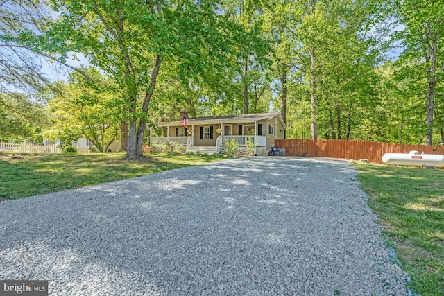 7 Hidden Lake Dr, Stafford, VA 22556 - view of front of property with driveway, covered porch, and a chimney