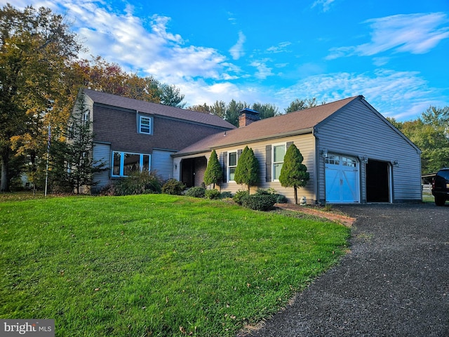 dutch colonial with a garage, a chimney, and a front yard