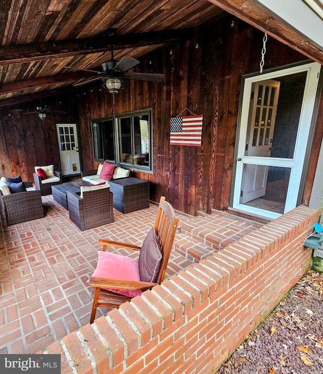 view of patio with a ceiling fan and outdoor lounge area