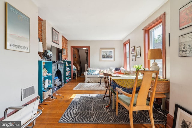 dining area with hardwood / wood-style floors