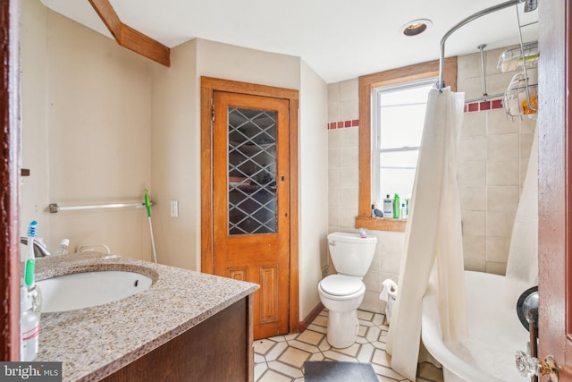 bathroom featuring toilet, tile walls, vanity, and shower / bath combination with curtain