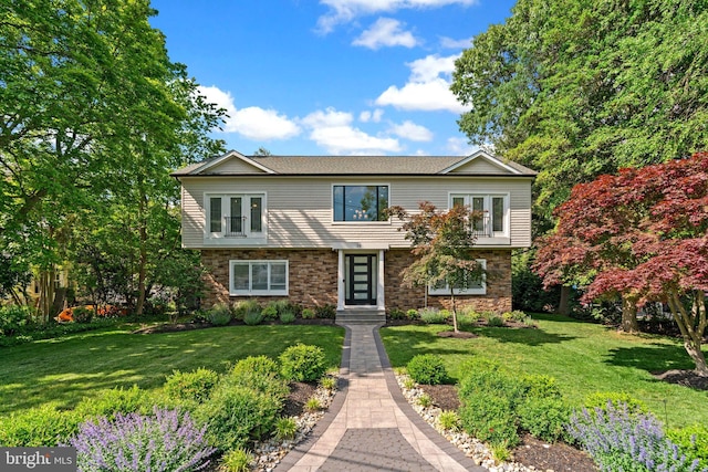 36 Boone Trl, Severna Park, MD 21146 - view of front of house with french doors, stone siding, and a front lawn