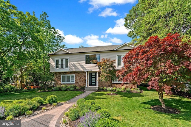 36 Boone Trl, Severna Park, MD 21146 - view of front of property with a front yard and stone siding