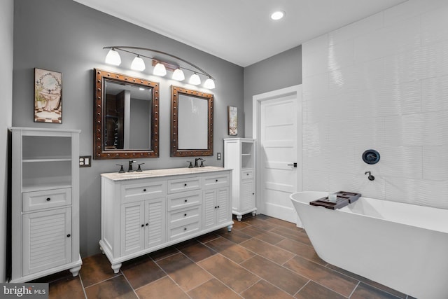 36 Boone Trl, Severna Park, MD 21146 - bathroom with double vanity, a freestanding bath, and recessed lighting