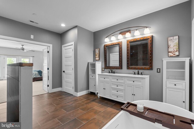 36 Boone Trl, Severna Park, MD 21146 - ensuite bathroom featuring double vanity, ceiling fan, baseboards, recessed lighting, and wood finish floors