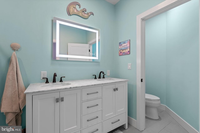 36 Boone Trl, Severna Park, MD 21146 - bathroom featuring double vanity, toilet, baseboards, and tile patterned floors