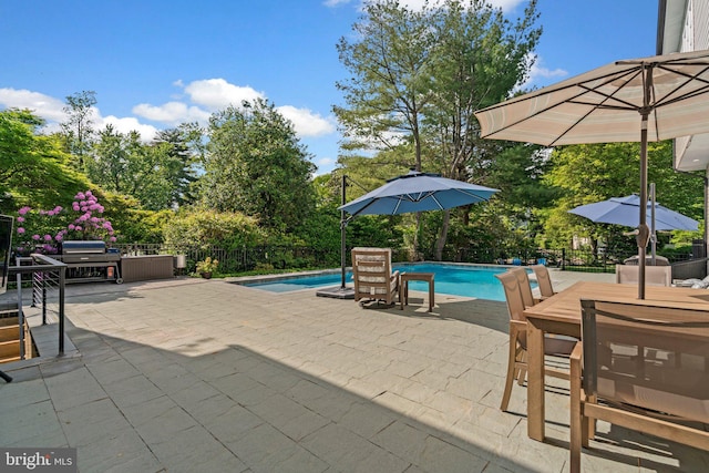 36 Boone Trl, Severna Park, MD 21146 - view of swimming pool featuring a patio, grilling area, view of scattered trees, and outdoor dining area
