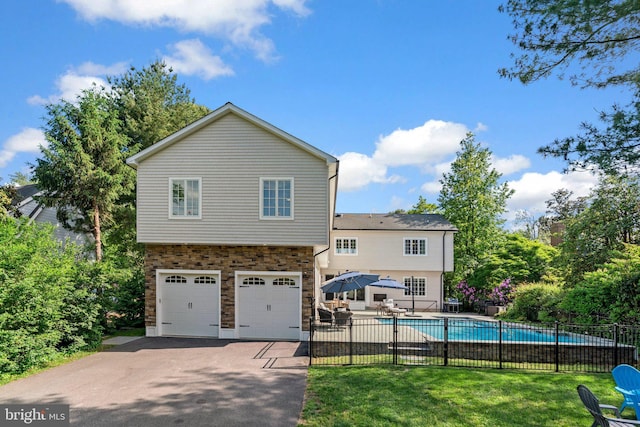 36 Boone Trl, Severna Park, MD 21146 - back of property featuring driveway, stone siding, and a garage