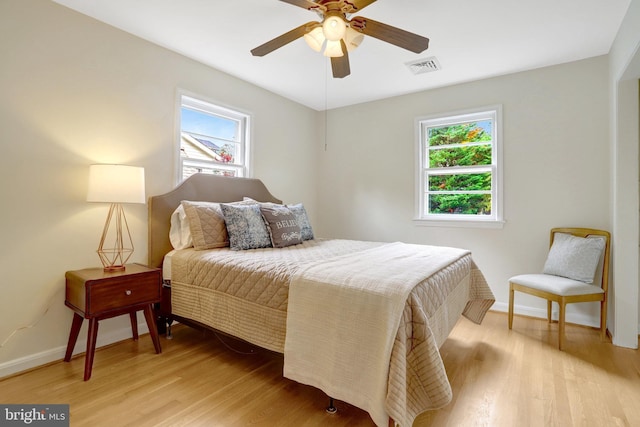 1807 N Barton St, Arlington, VA 22201 - bedroom featuring multiple windows, light wood-style flooring, and baseboards