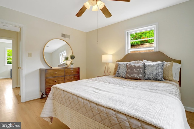 1807 N Barton St, Arlington, VA 22201 - bedroom with multiple windows, wood finished floors, and baseboards