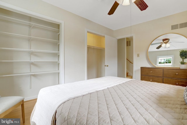 1807 N Barton St, Arlington, VA 22201 - bedroom featuring two closets, wood finished floors, a ceiling fan, and baseboards