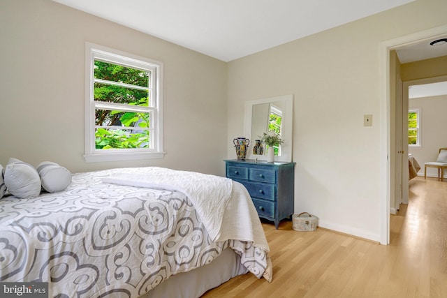 1807 N Barton St, Arlington, VA 22201 - bedroom featuring multiple windows, light wood-style flooring, and baseboards