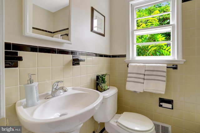 1807 N Barton St, Arlington, VA 22201 - bathroom with a sink, plenty of natural light, tile walls, and toilet
