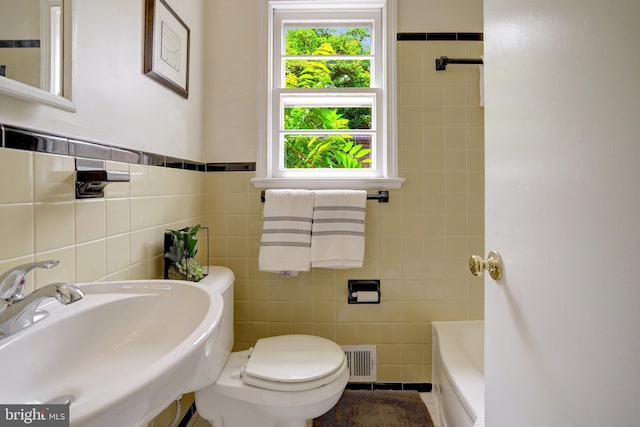 1807 N Barton St, Arlington, VA 22201 - full bathroom featuring tile walls, a sink, toilet, and a tub