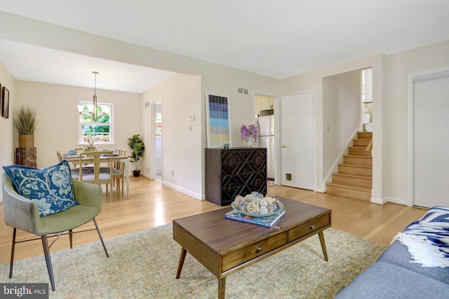 1807 N Barton St, Arlington, VA 22201 - living room featuring light wood-type flooring, stairway, and baseboards