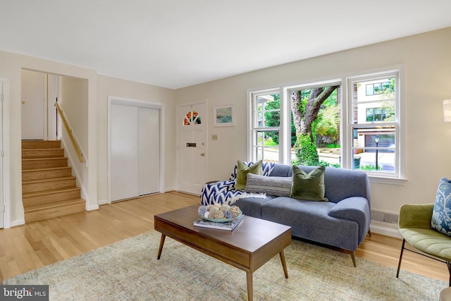 1807 N Barton St, Arlington, VA 22201 - living room with light wood-type flooring, stairway, and baseboards
