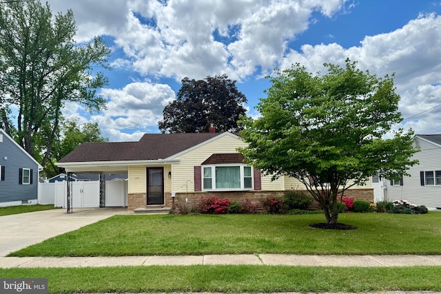 single story home featuring driveway and an attached carport
