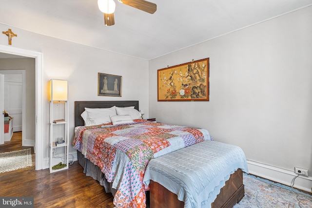 bedroom featuring wood finished floors, baseboards, and ceiling fan