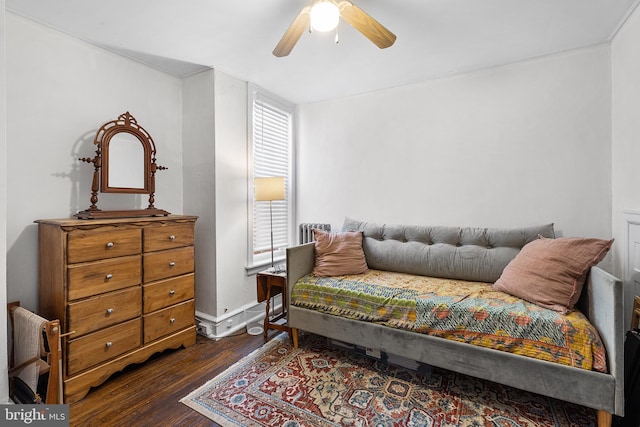 sitting room with wood finished floors, ceiling fan, and baseboards