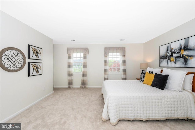 bedroom featuring baseboards and carpet floors