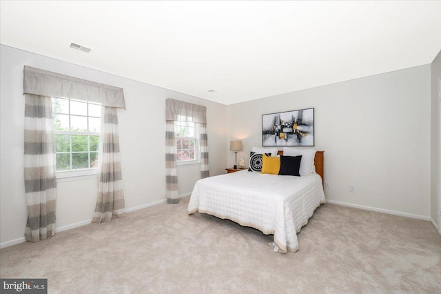 bedroom featuring carpet flooring and baseboards