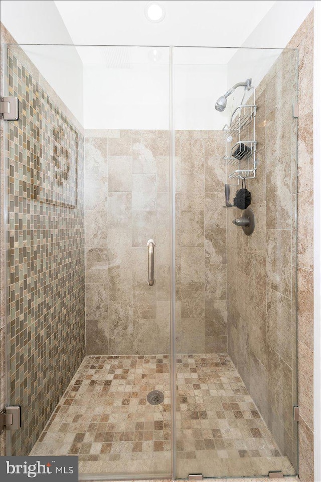 full bathroom with a shower stall