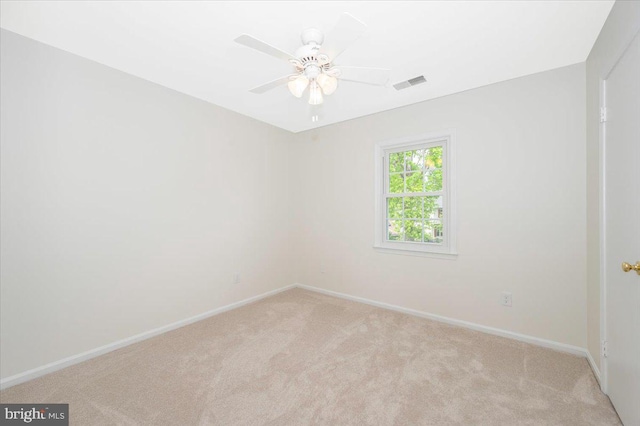 empty room with light carpet, baseboards, and ceiling fan