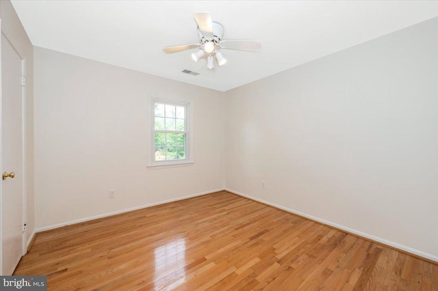unfurnished room featuring light wood-type flooring, baseboards, and ceiling fan