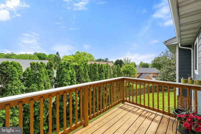 wooden deck with a yard