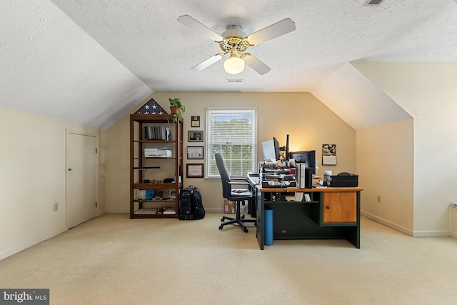 office featuring carpet flooring, a textured ceiling, lofted ceiling, ceiling fan, and baseboards