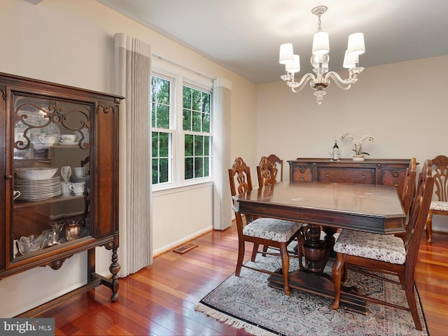 5731 Wooden Spoon Ct, Burke, VA 22015 - dining space with hardwood / wood-style flooring, a chandelier, and baseboards