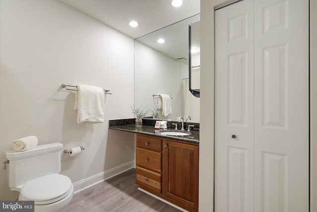 5731 Wooden Spoon Ct, Burke, VA 22015 - full bath featuring baseboards, toilet, wood finished floors, vanity, and recessed lighting