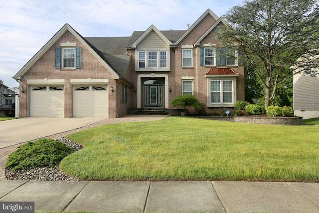 16 Cotswold Way, Sewell, NJ 08080 - view of front of home featuring brick siding, concrete driveway, and a front lawn
