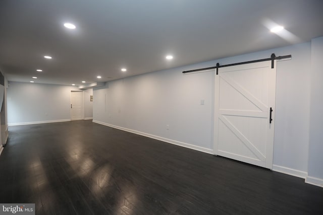 16 Cotswold Way, Sewell, NJ 08080 - basement featuring a barn door, baseboards, dark wood-style flooring, and recessed lighting